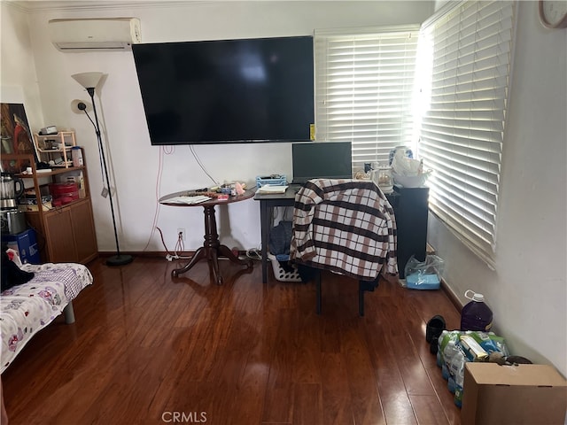 office area featuring wood-type flooring and a wall unit AC