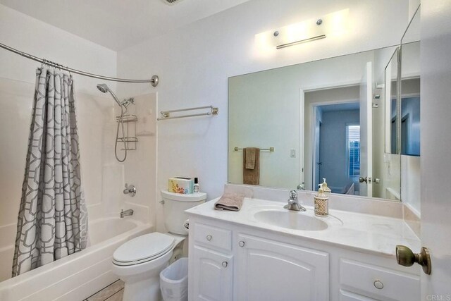 569 Prado Verde, San Marcos, CA 92069 - full bathroom featuring vanity, shower / bathtub combination with curtain, and toilet