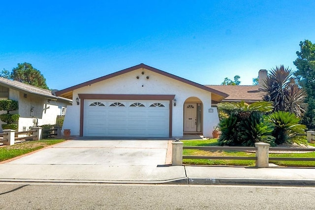 ranch-style house featuring a garage