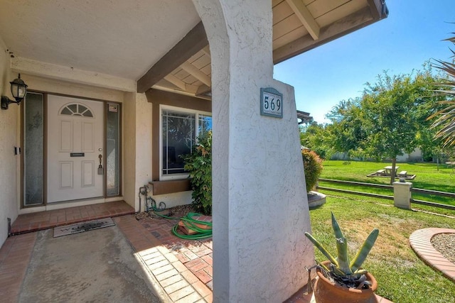 569 Prado Verde, San Marcos, CA 92069 - doorway to property with a lawn