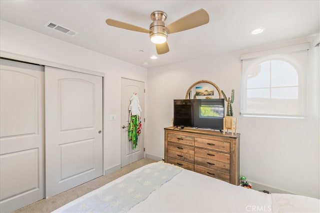 carpeted bedroom featuring ceiling fan