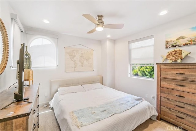 carpeted bedroom with ceiling fan