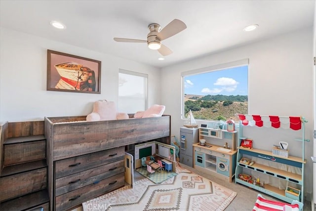 carpeted bedroom featuring ceiling fan