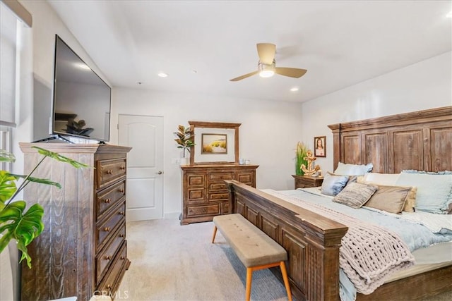 carpeted bedroom with ceiling fan