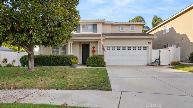 traditional-style home featuring concrete driveway, a front lawn, fence, and stucco siding