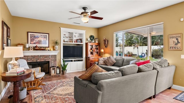 living room featuring light tile patterned floors, built in shelves, visible vents, and a fireplace