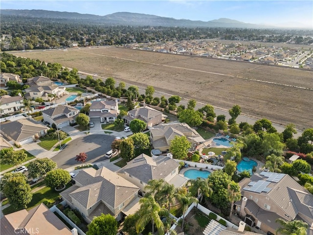 bird's eye view featuring a residential view and a mountain view