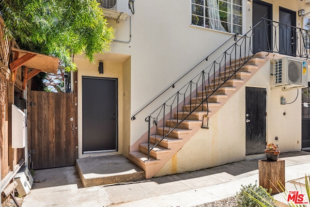 doorway to property with ac unit