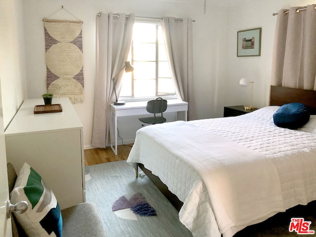 bedroom featuring light wood-type flooring