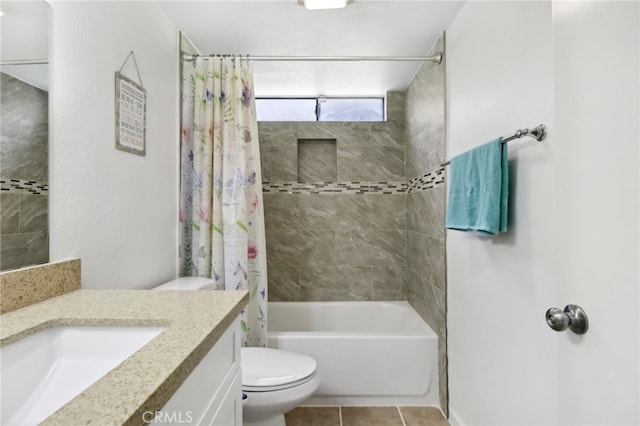 full bathroom featuring vanity, tile patterned flooring, toilet, and shower / bath combo