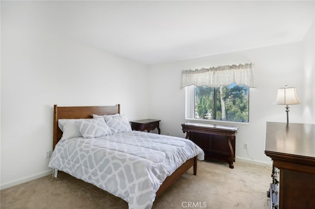 bedroom with light carpet