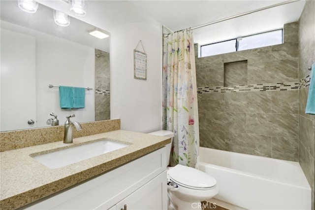 full bathroom featuring vanity, toilet, and shower / bath combo