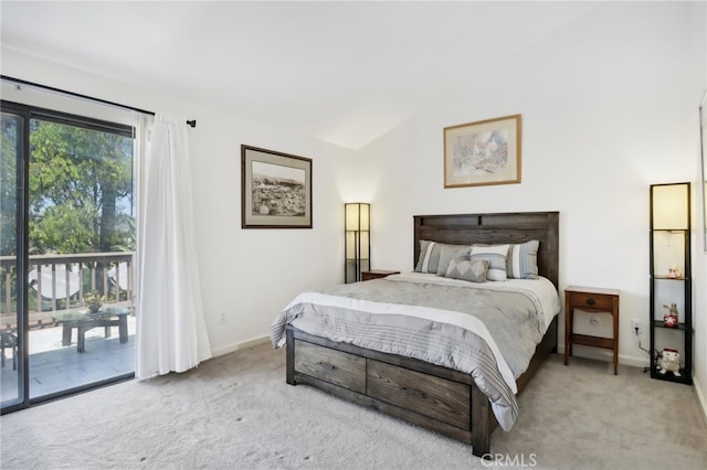 carpeted bedroom featuring vaulted ceiling and access to outside