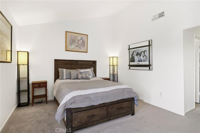 carpeted bedroom featuring lofted ceiling