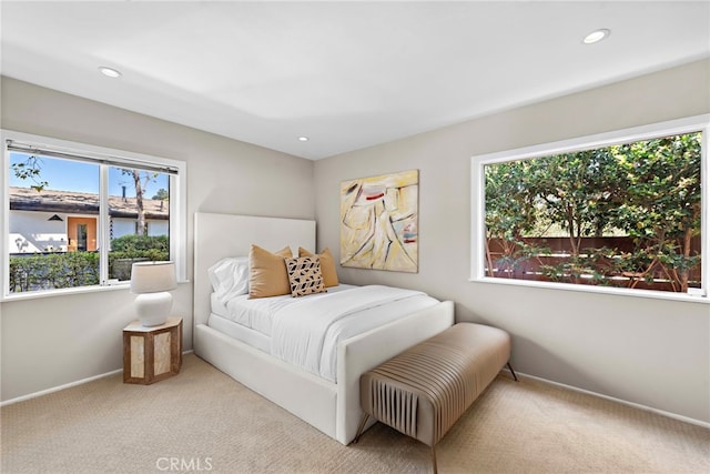 bedroom with light colored carpet