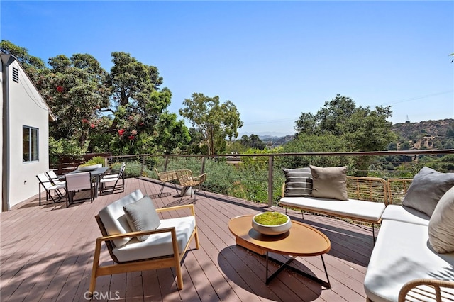 deck featuring outdoor lounge area