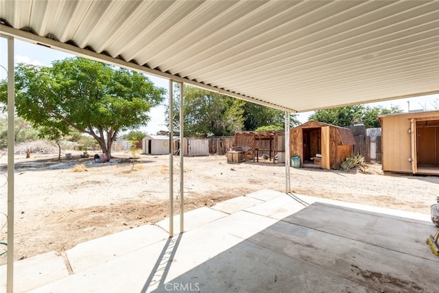 view of patio / terrace with a storage shed