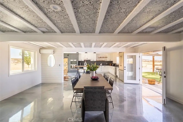 dining room featuring beam ceiling and a wall mounted AC