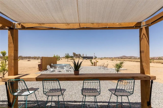 view of patio / terrace featuring a rural view