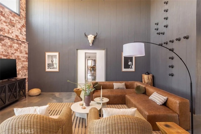 living room featuring wood walls