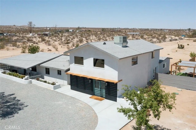 view of front of property with central AC unit