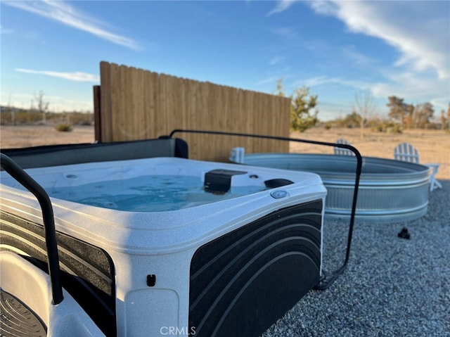 exterior details featuring a jacuzzi