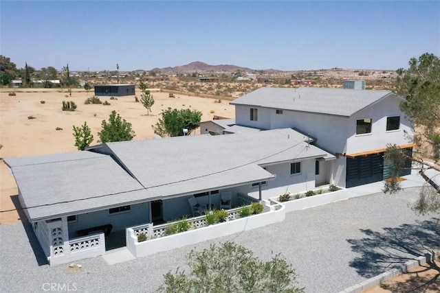 birds eye view of property featuring a mountain view