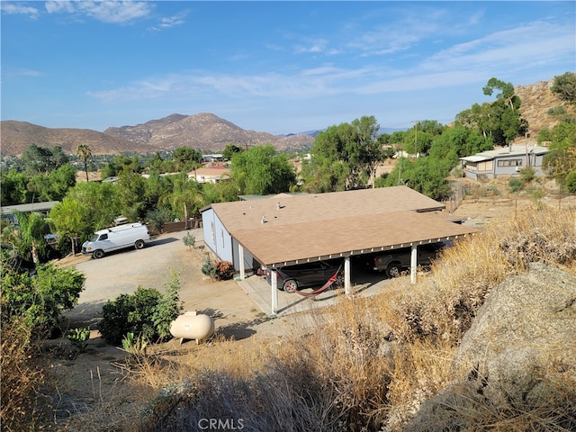 birds eye view of property featuring a mountain view