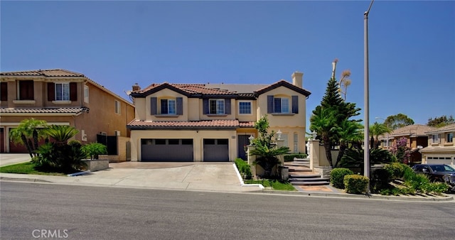 mediterranean / spanish home featuring a garage