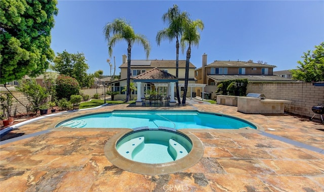 view of swimming pool featuring a gazebo, an in ground hot tub, and a patio area