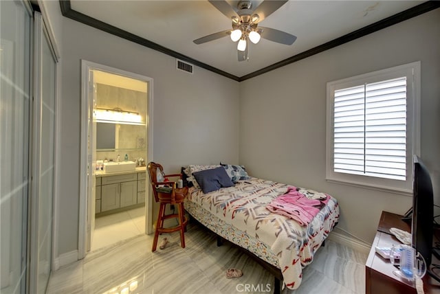 bedroom with connected bathroom, ceiling fan, sink, and crown molding