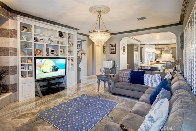 living room featuring an inviting chandelier and crown molding