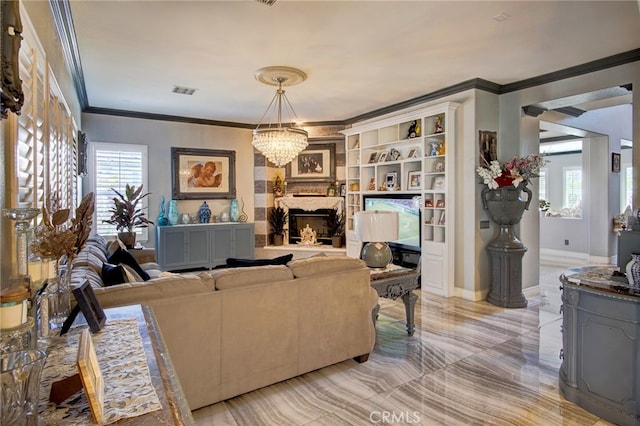 living room with ornamental molding and an inviting chandelier