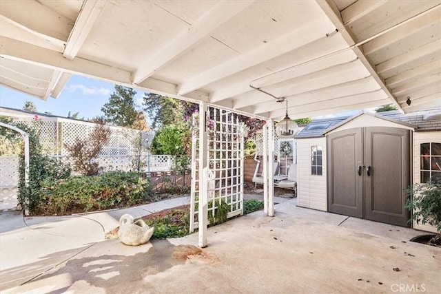 view of patio with a storage unit