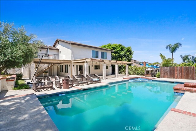 view of swimming pool with a patio and a pergola