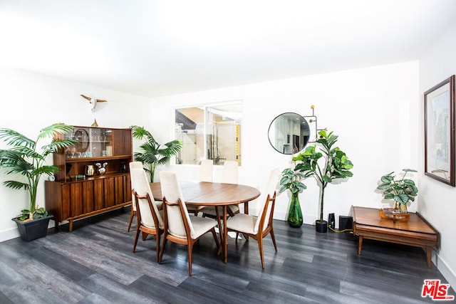 dining area featuring dark hardwood / wood-style floors