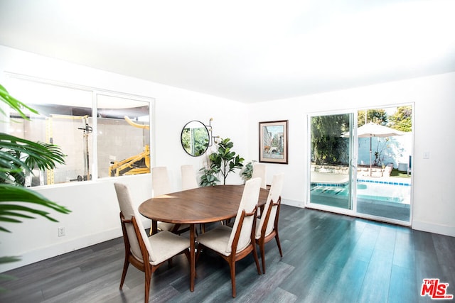 dining space featuring dark hardwood / wood-style flooring