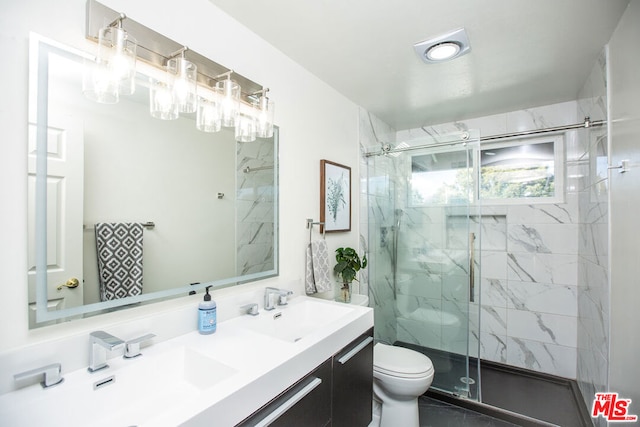 bathroom with vanity, toilet, and walk in shower