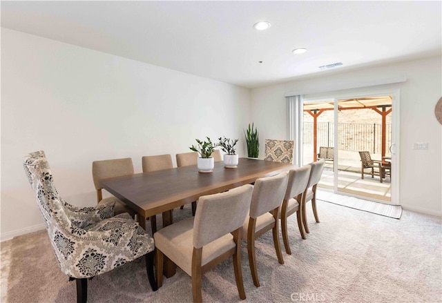 view of carpeted dining area