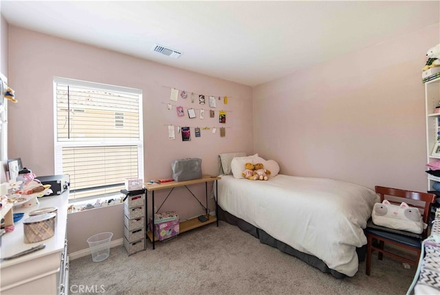 bedroom with light colored carpet