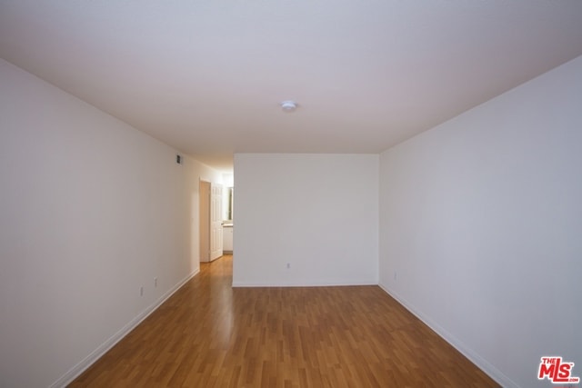 spare room with light hardwood / wood-style flooring