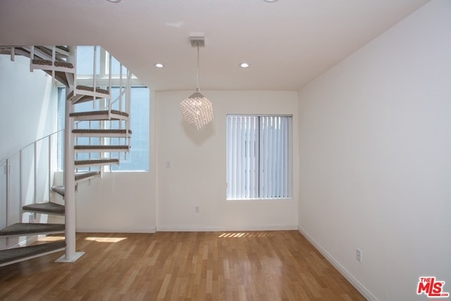 unfurnished dining area with hardwood / wood-style flooring