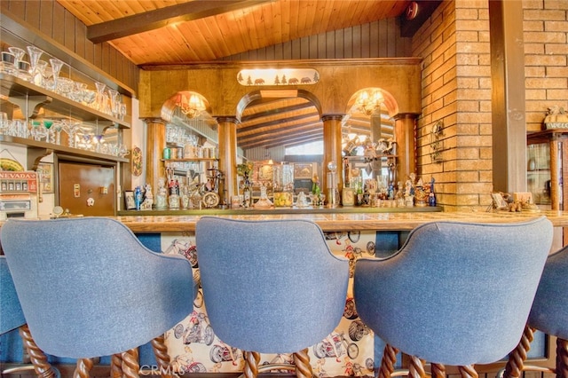 bar with vaulted ceiling with beams, wood ceiling, brick wall, and wood walls