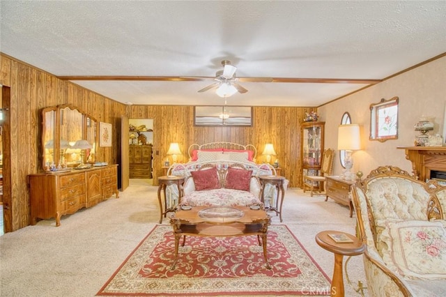 carpeted bedroom with ornamental molding, wooden walls, and a textured ceiling