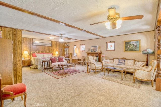 carpeted bedroom with a textured ceiling and wood walls