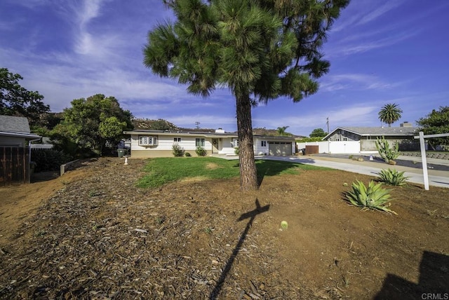 ranch-style home featuring a front yard