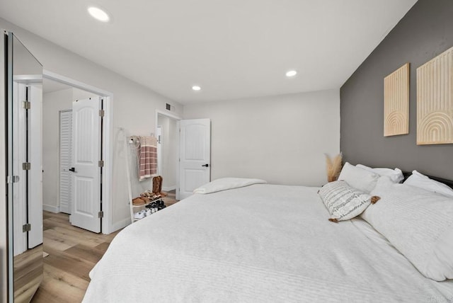 bedroom with light hardwood / wood-style flooring