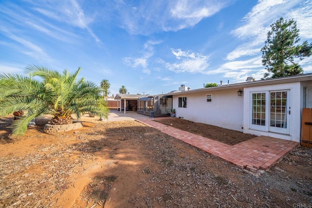 back of house with a patio area