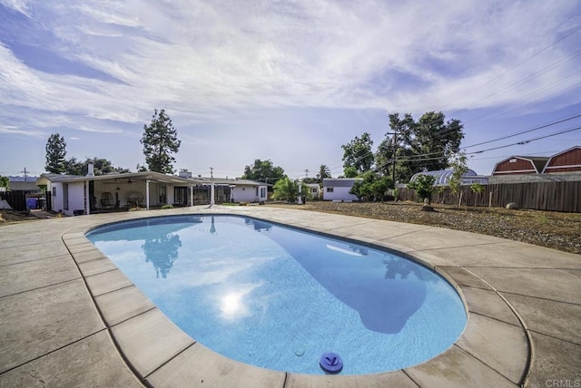 view of swimming pool with a patio