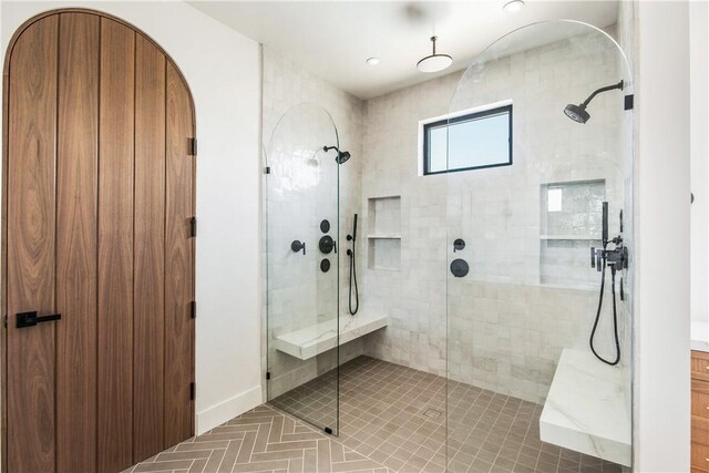 bathroom with tile patterned floors and walk in shower